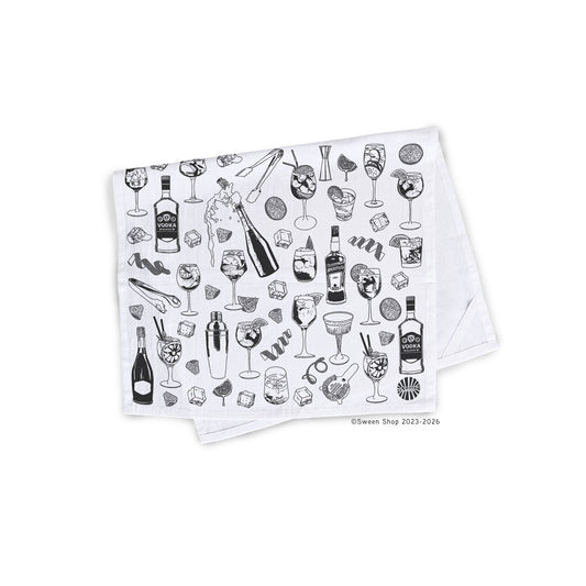 Folded Cotton kitchen towel with black aperol spritz cocktail illustrations on a white background