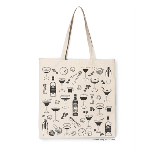 Beige cotton canvas tote bag with espresso martini cocktail-themed illustrations on a white background