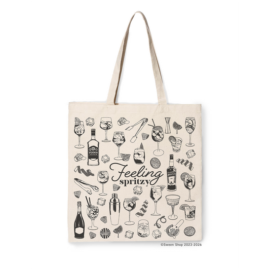 natural cotton canvas Tote bag with aperol spritz cocktail drink-themed design and 'Feeling spritz' text on a white background