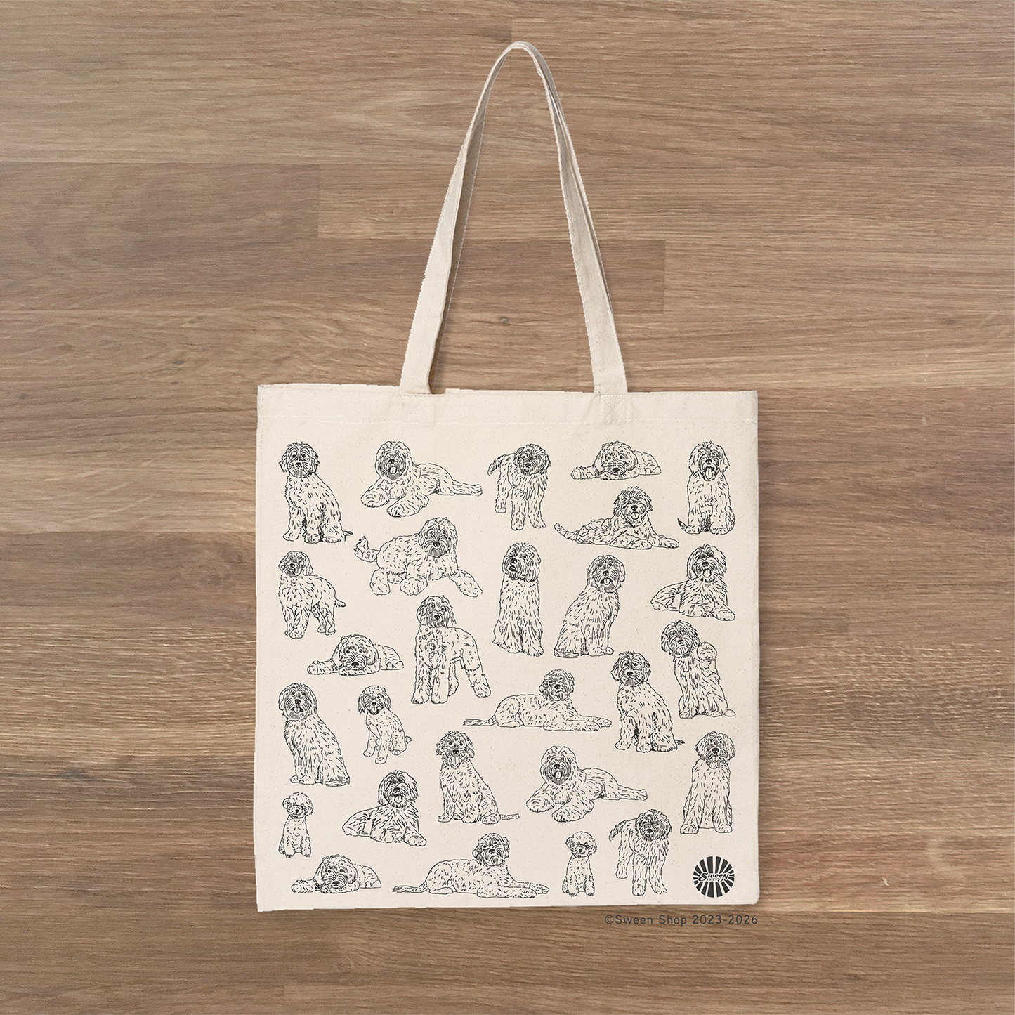 natural cotton canvas Tote bag with labradoodle pet dog illustrations on a wooden surface