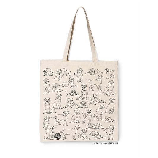 natural cotton camvas tote bag with black line drawings of labrador pet dogs on a white background