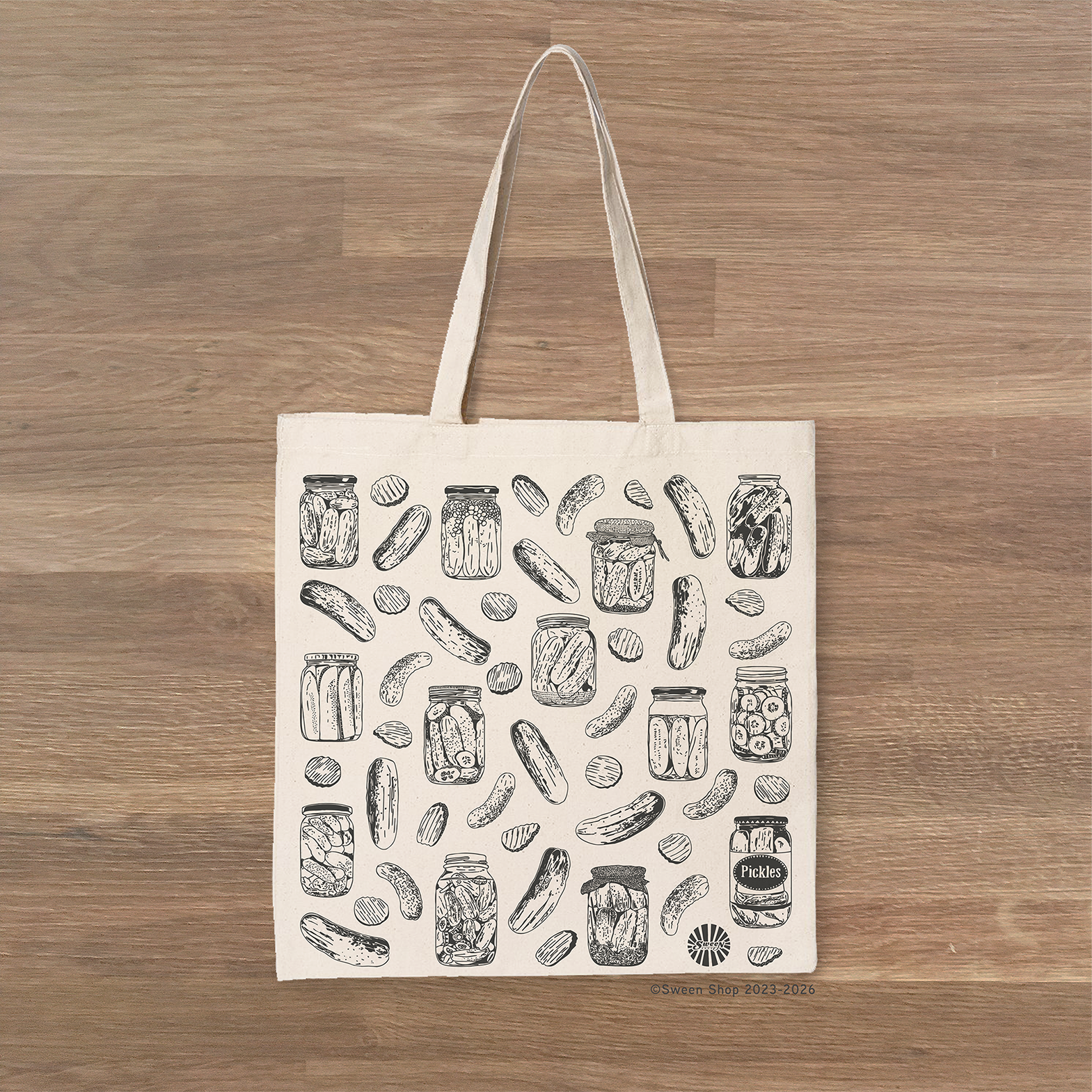 cotton canvas Tote bag with hand drawn pickle pattern on a wooden surface