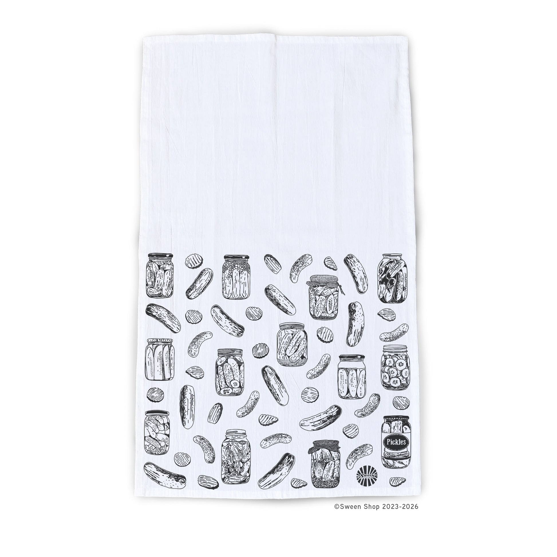 White towel with black line drawing of pickle and jar pattern on a white background