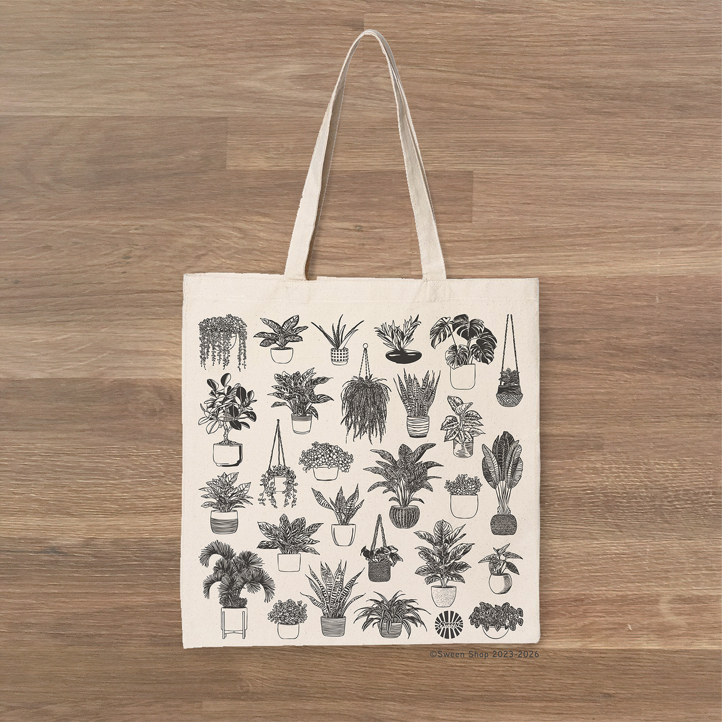 natural cotton canvas Tote bag with house plant illustrations on a wooden surface