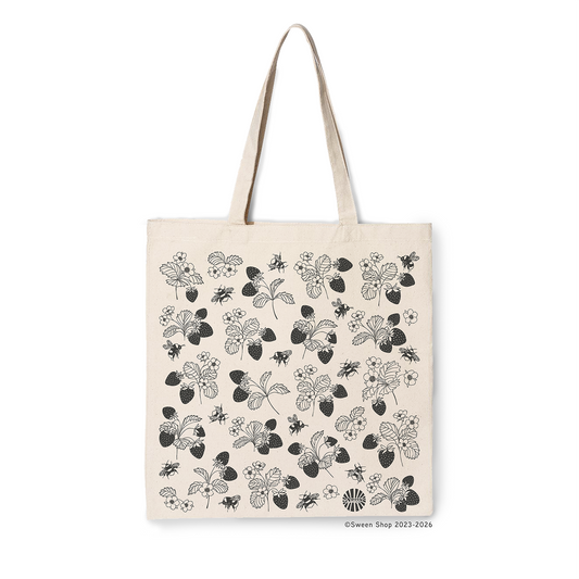 Natural cotton canvas tote bag with black floral  strawberry and bumble bee hand drawn illustration on a white background