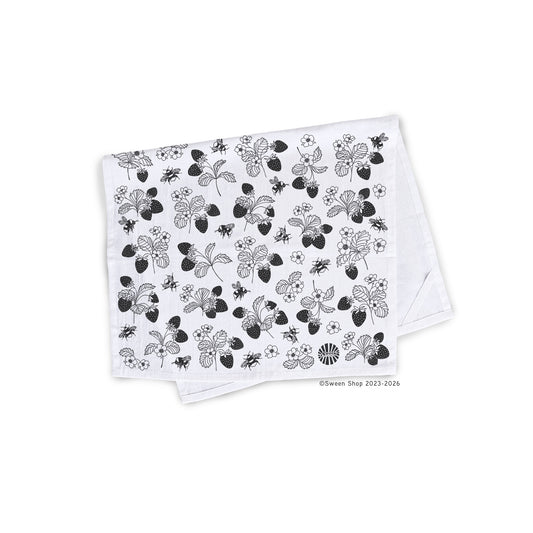 !00% Cotton Kitchen Tea Towel with black hand drawn floral strawberry and bumble bee patterns on a white background