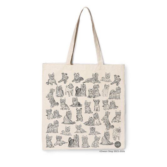Natural cotton canvas tote bag with hand drawn yorkshire terrier illustrations on a white background