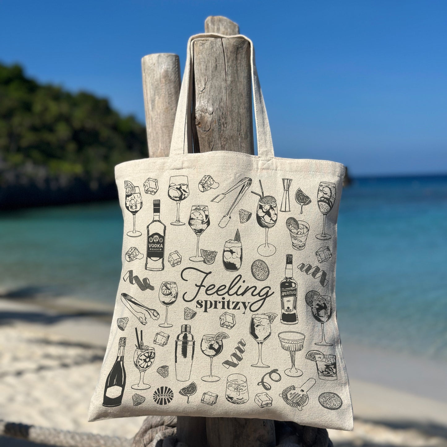beach Tote bag with aperol spritz cocktail drink-themed design on a beach setting
