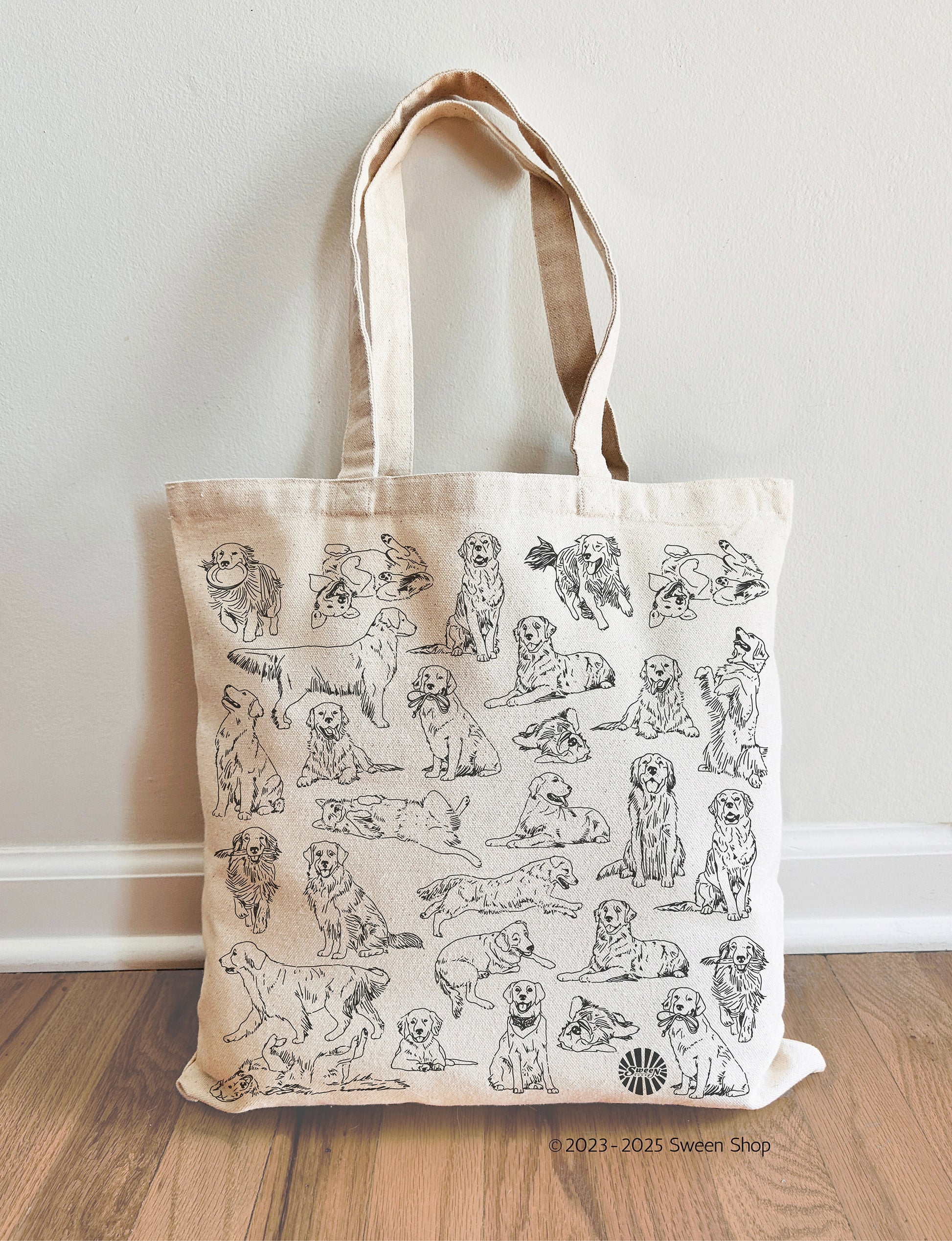 Tote bag with golden retriever pet dog illustrations on a beige background