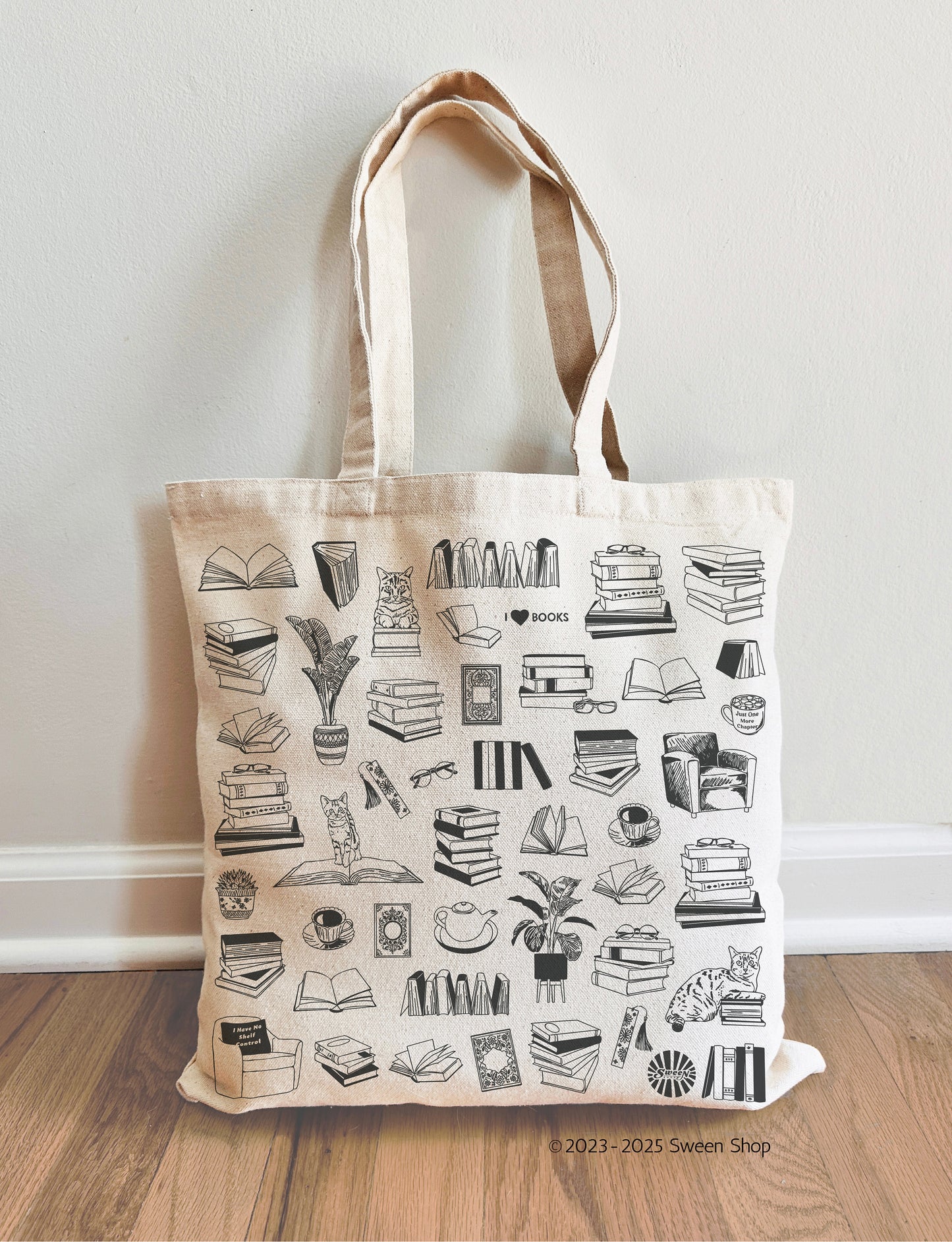 natural cotton canvas Tote bag with black line art reading books, plants ,cats, coffee designs on a beige background